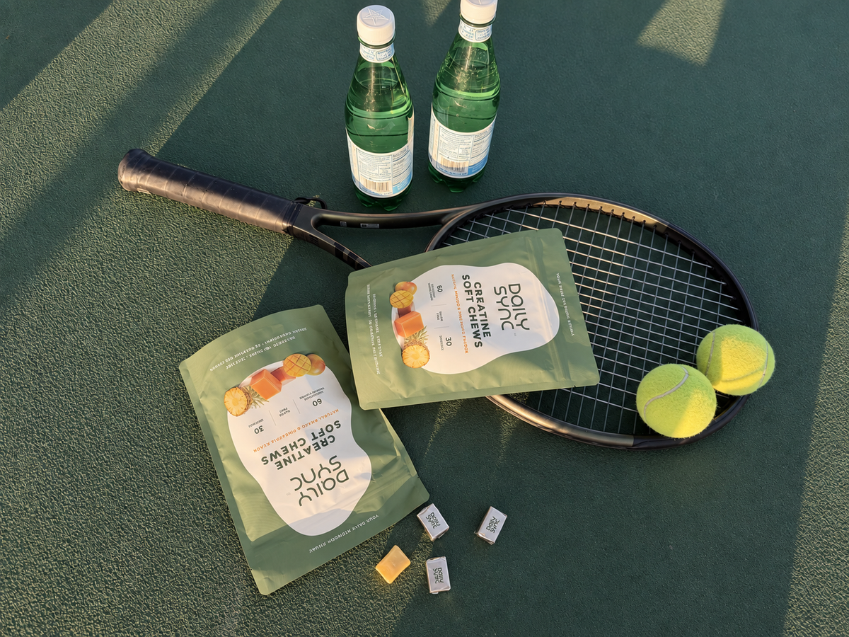 Daily Sync creatine chews with a tennis racket and balls